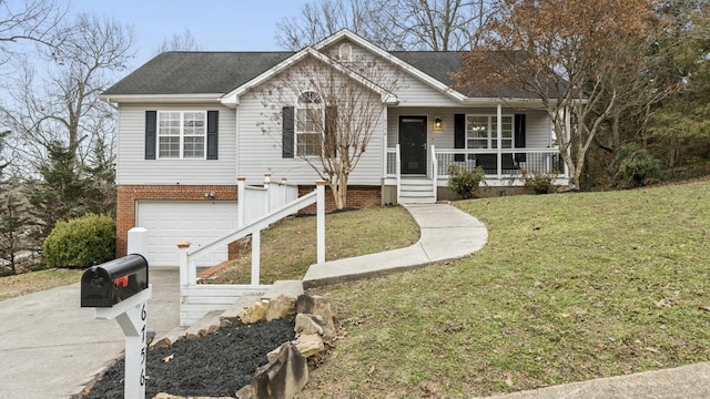 view of front of property with a garage, a front yard, and a porch