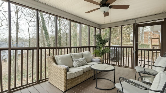 sunroom / solarium with ceiling fan and a healthy amount of sunlight