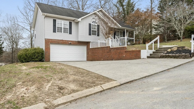 view of front of property featuring a garage and covered porch