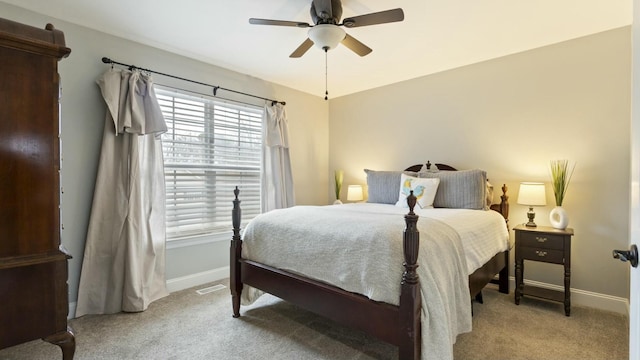 bedroom with ceiling fan and light colored carpet