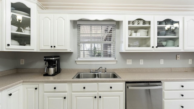 kitchen featuring sink, white cabinets, and stainless steel dishwasher