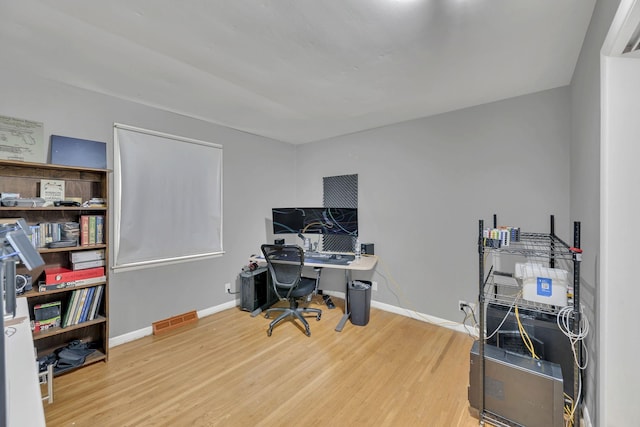 office with wood-type flooring