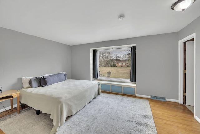 bedroom featuring hardwood / wood-style flooring