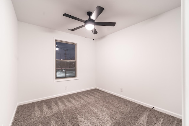 unfurnished room featuring carpet floors, ceiling fan, and baseboards