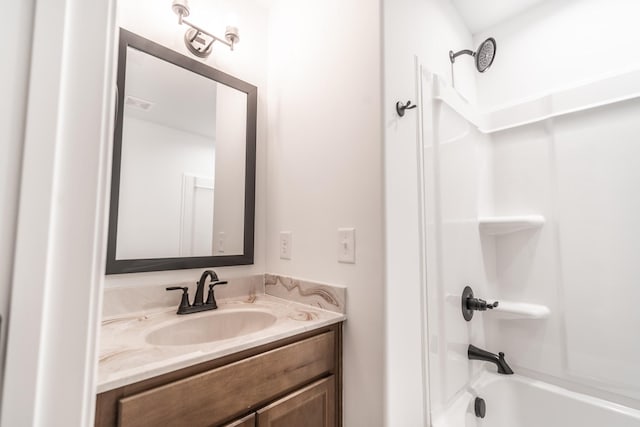 full bath featuring vanity, shower / tub combination, and visible vents