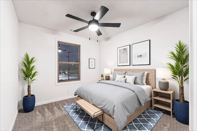 carpeted bedroom featuring a ceiling fan and baseboards