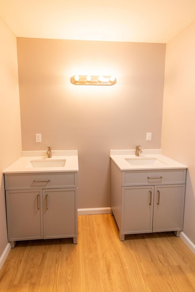 bathroom featuring hardwood / wood-style flooring and vanity