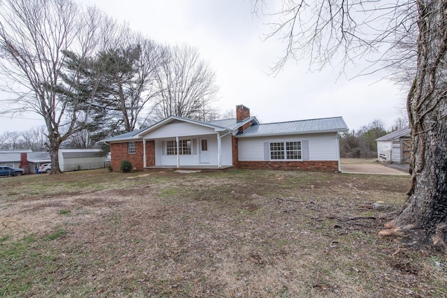 single story home featuring covered porch and a garage