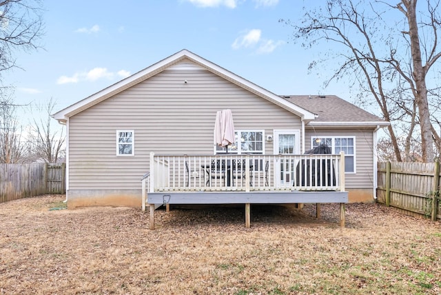 back of house featuring a deck