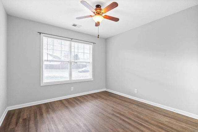 unfurnished room featuring dark hardwood / wood-style flooring and ceiling fan