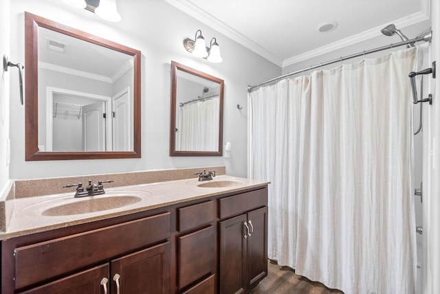 bathroom with vanity, hardwood / wood-style flooring, a shower with curtain, and ornamental molding