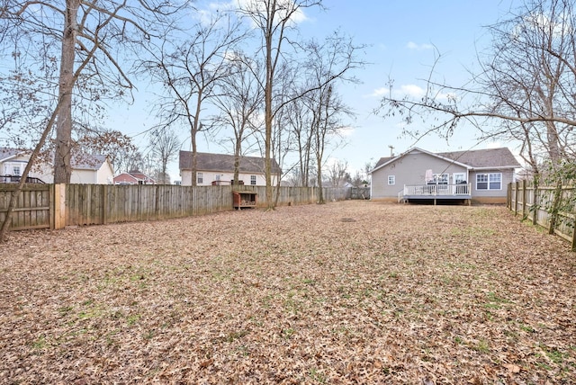 view of yard with a wooden deck