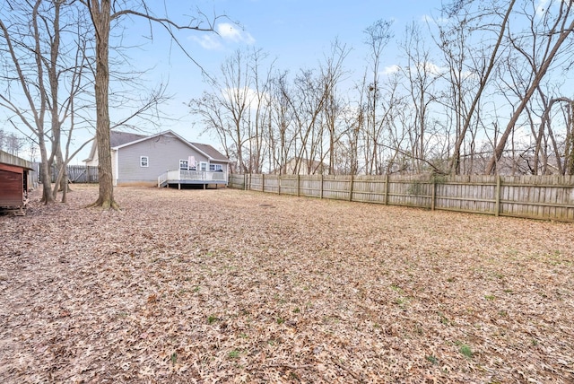 view of yard with a wooden deck