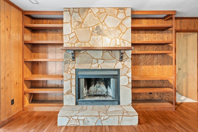 room details featuring wood-type flooring and a fireplace