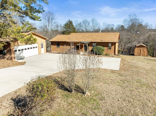 ranch-style home with a garage, a shed, and a front yard