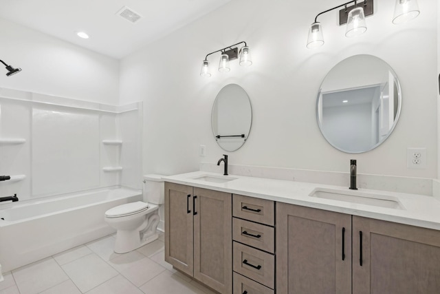 full bathroom featuring tile patterned floors, toilet, shower / washtub combination, and vanity