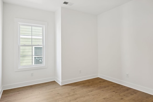 unfurnished room with light hardwood / wood-style flooring