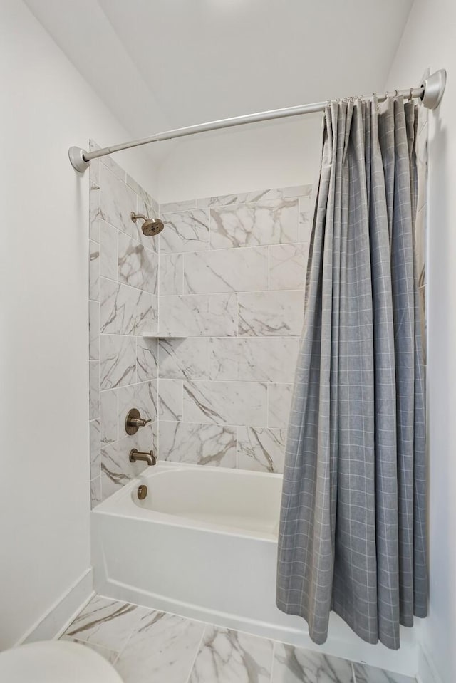 bathroom featuring shower / bath combination with curtain