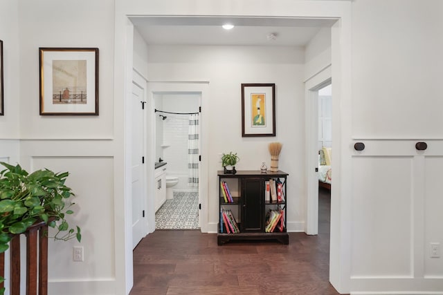 hallway featuring dark hardwood / wood-style floors