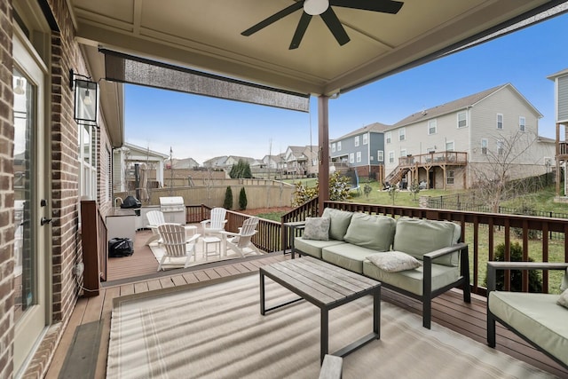 deck featuring ceiling fan and an outdoor hangout area