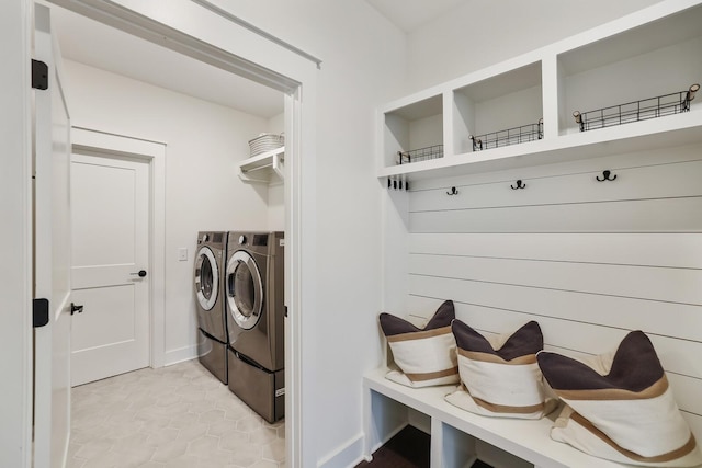 clothes washing area featuring separate washer and dryer and light tile patterned floors