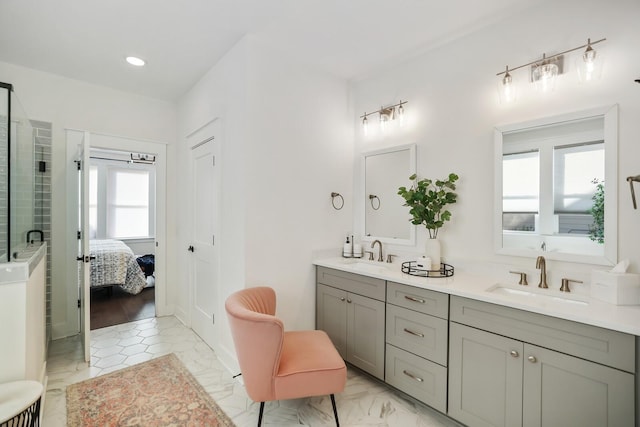 bathroom with vanity and an enclosed shower