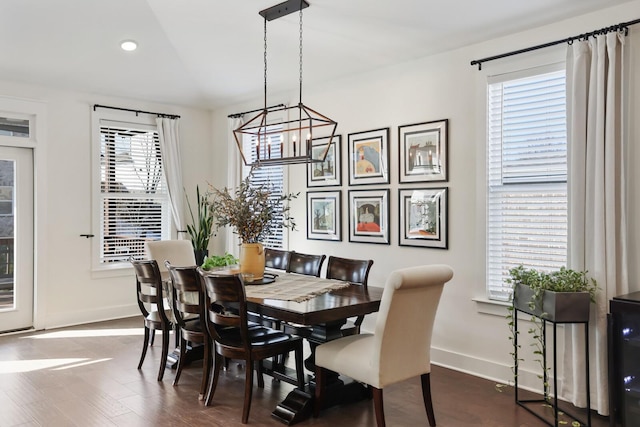 dining room with dark hardwood / wood-style flooring