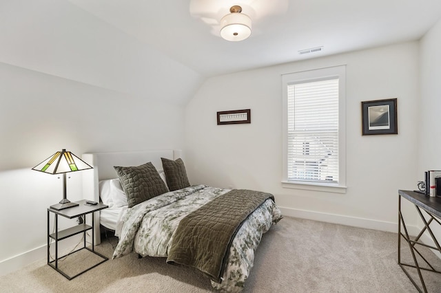 carpeted bedroom featuring vaulted ceiling