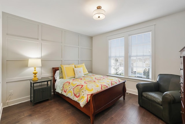 bedroom with dark wood-type flooring