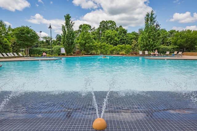 view of swimming pool featuring pool water feature