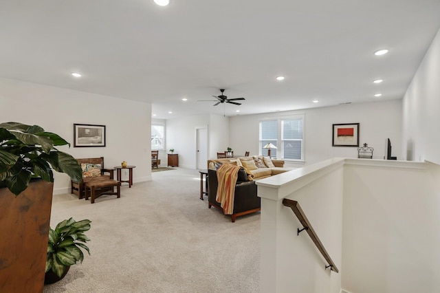 living room featuring ceiling fan and light carpet