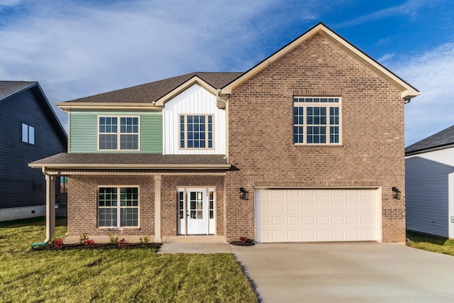 traditional-style house with a garage, brick siding, concrete driveway, board and batten siding, and a front yard