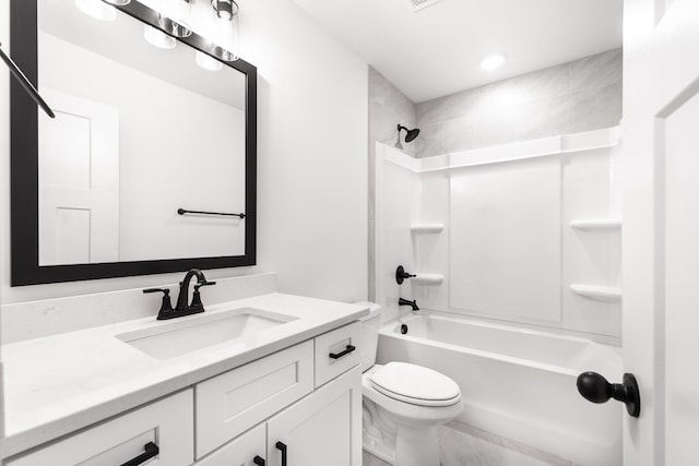 bathroom featuring toilet, bathtub / shower combination, and vanity