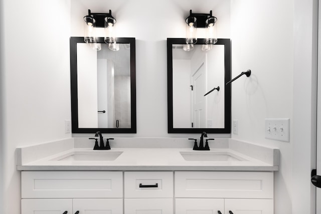 full bathroom with double vanity and a sink