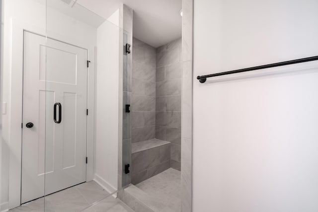 full bathroom featuring a shower stall and tile patterned floors