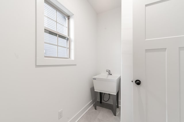 bathroom with baseboards