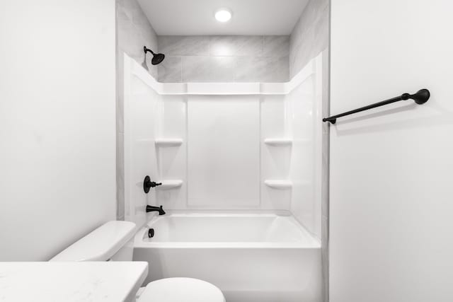 full bath with washtub / shower combination, vanity, and toilet