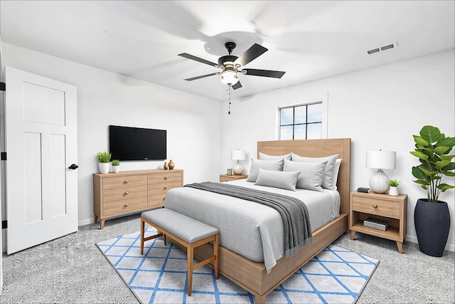 carpeted bedroom featuring visible vents, ceiling fan, and baseboards