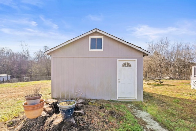 view of outbuilding featuring a lawn