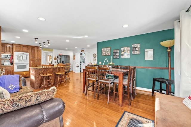 dining room featuring light wood-type flooring