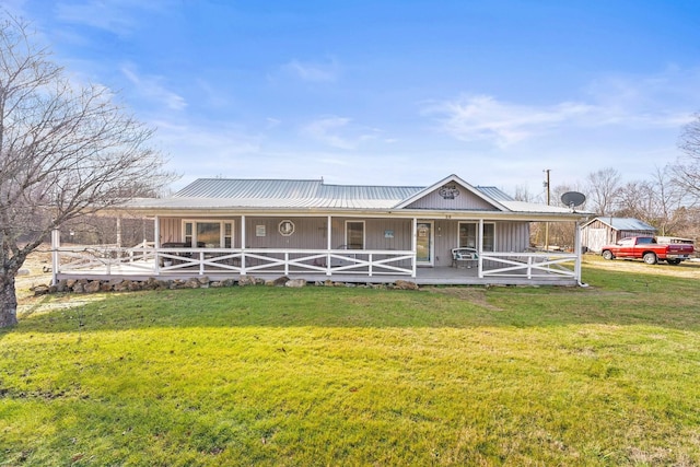 view of front of property with covered porch and a front yard