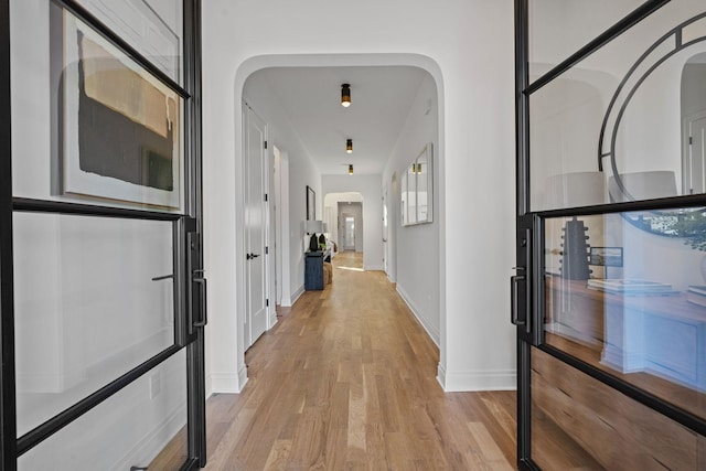 corridor featuring light hardwood / wood-style flooring