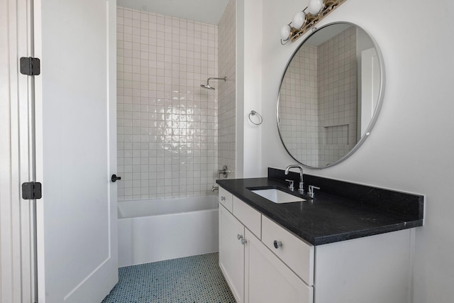 bathroom featuring vanity, tile patterned floors, and shower / bathing tub combination