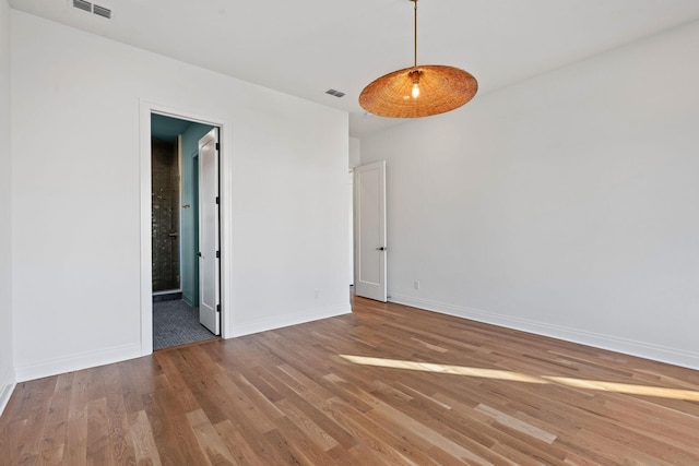 empty room featuring hardwood / wood-style floors