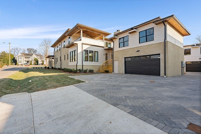 modern home with a garage and a front yard