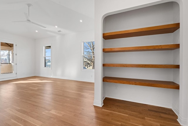 interior space with hardwood / wood-style floors and ceiling fan