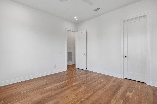 unfurnished bedroom featuring ceiling fan and light hardwood / wood-style flooring