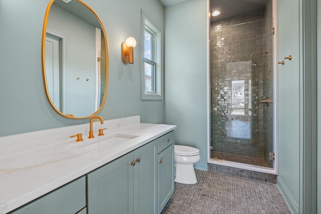 bathroom featuring vanity, toilet, an enclosed shower, and tile patterned flooring