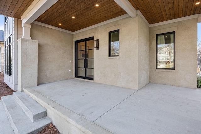 property entrance featuring a patio