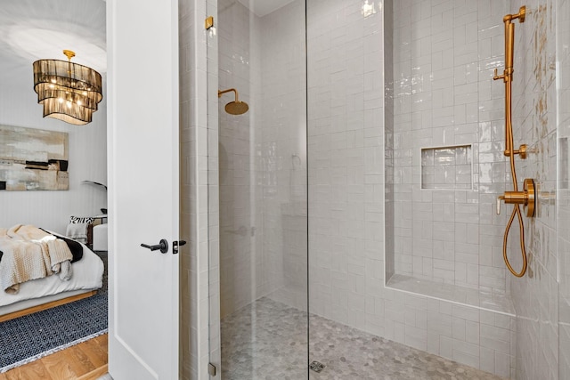 bathroom featuring hardwood / wood-style floors and walk in shower